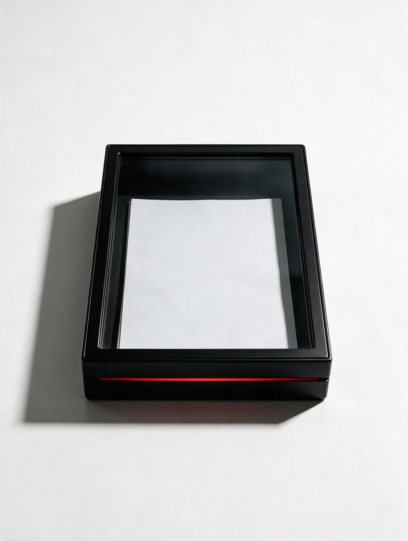 Closed black box with a single sheet of paper inside